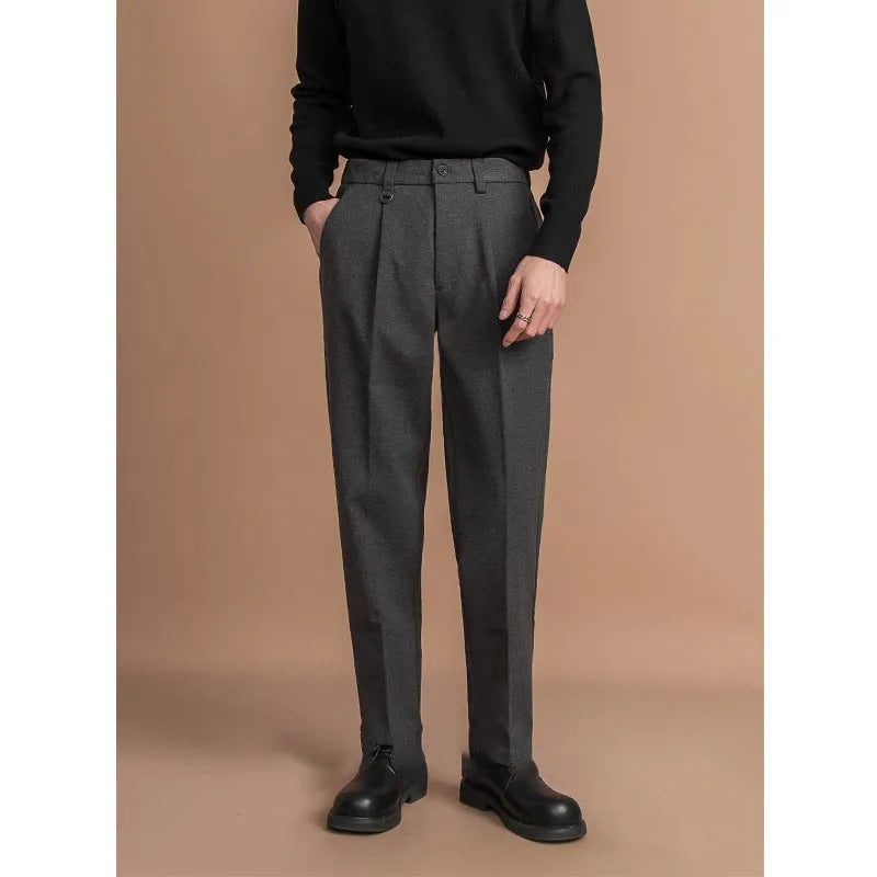 Men's straight leg polyester trousers in black, shown laid flat to display the cut and drape.