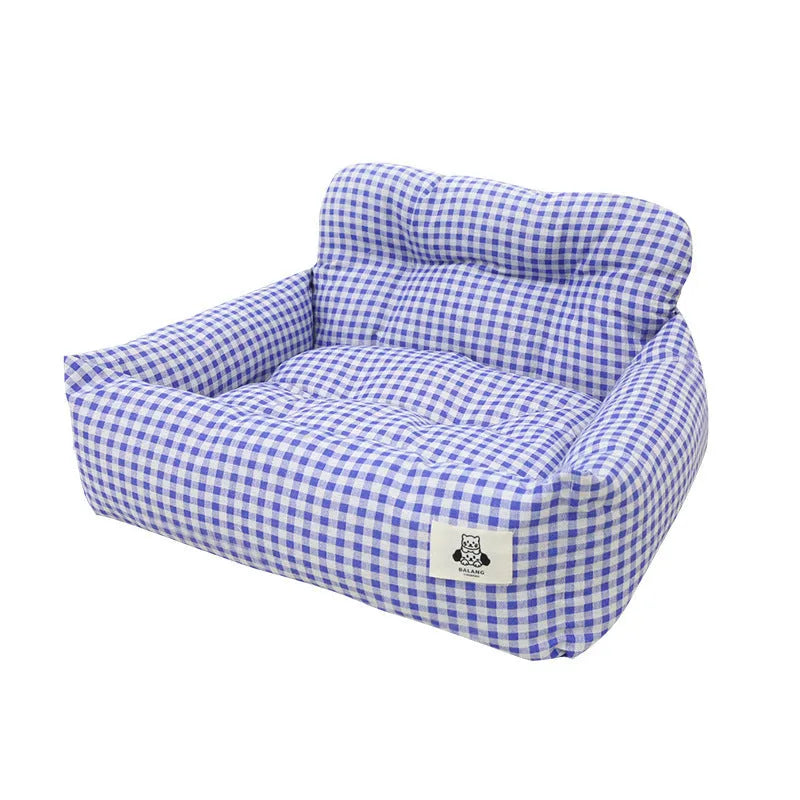 Car-mounted pet travel nest in grey and blue plaid colours showing stain-resistant cloth construction