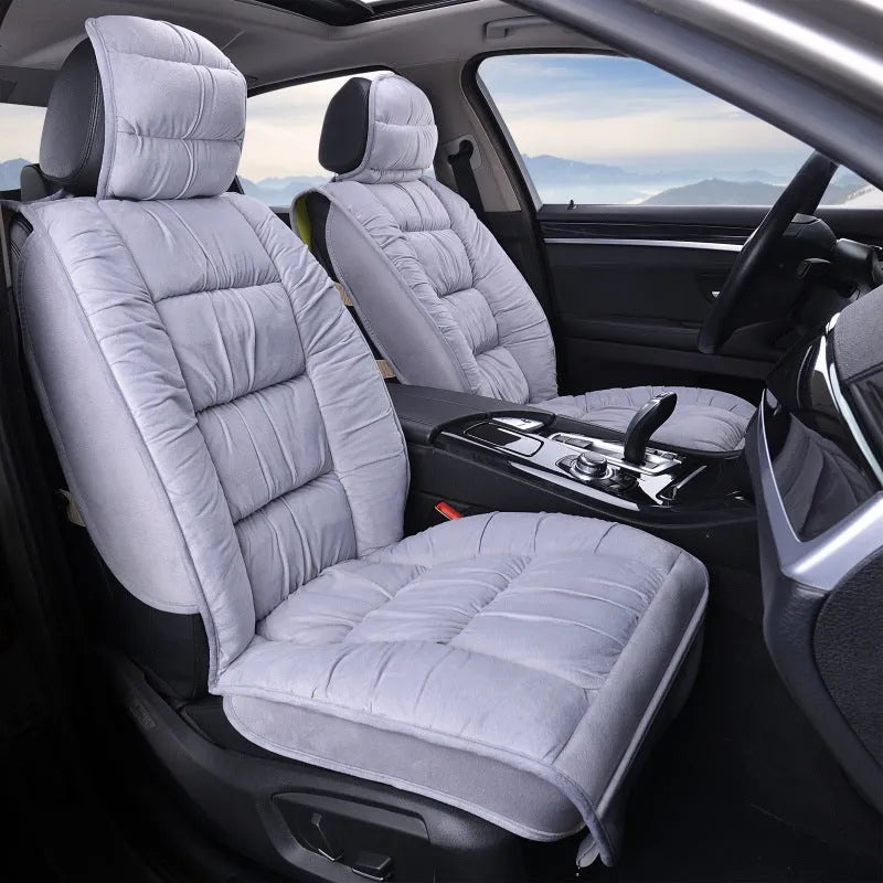 Plush winter car seat cushion shown in a grey set, with soft texture and fitting on a car seat.