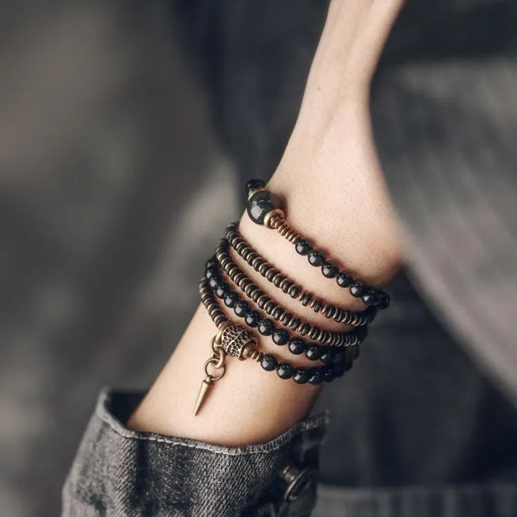 Black geometric multi layered bead bracelet with retro colourful beads on adjustable strap