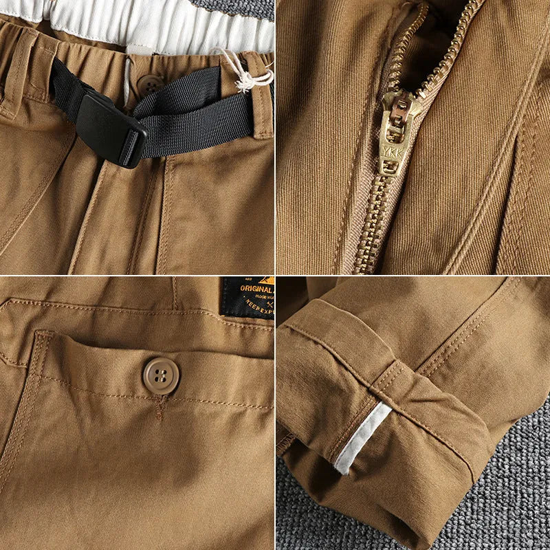 Men's khaki cotton work trousers featuring a buckle belt closure and a three-dimensional cut.