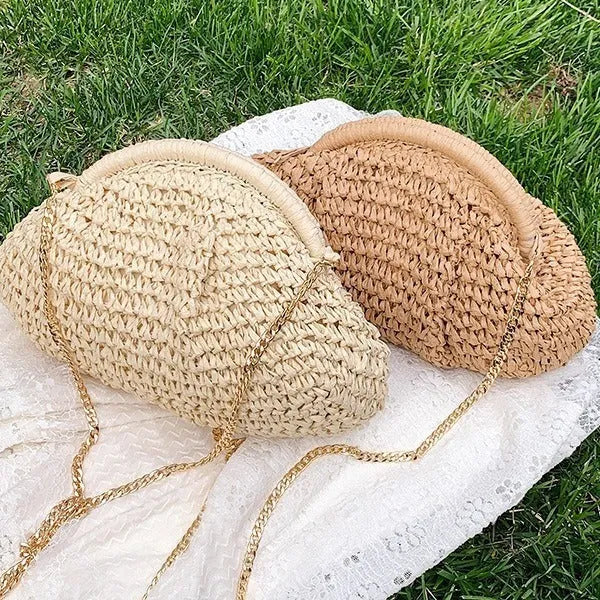 Women's straw handbag with shell shape, chain detail, and khaki colour option