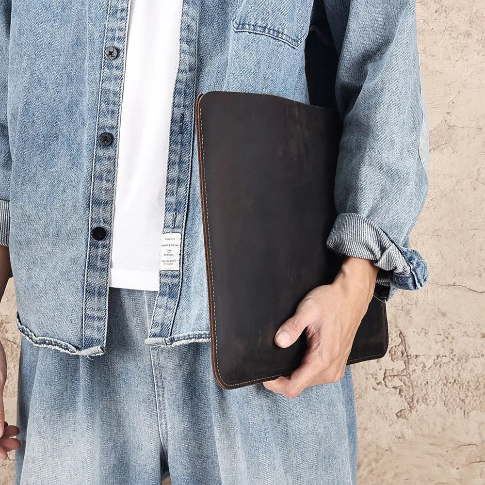 Brown genuine crazy horse leather computer bag with lined interior shown in medium and large sizes