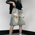 Blue retro-style tattered denim shorts with a wide leg loose fit on a hanger.