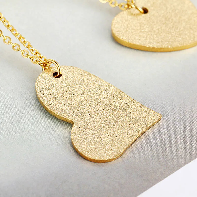 Women's titanium steel necklace with a geometric heart-shaped pendant in colour KN25736-Z