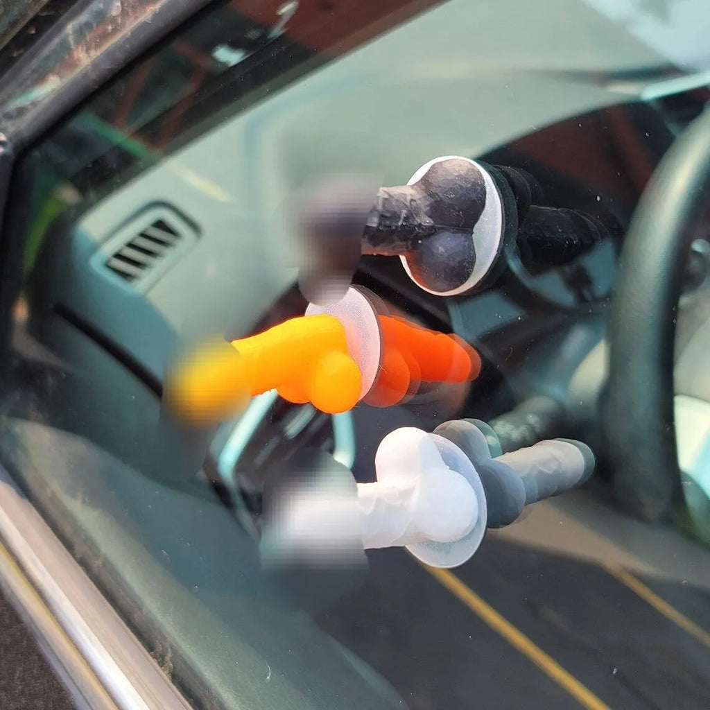 Set of five rubber tyre valve stem caps in pink, black, green, blue, and orange colours