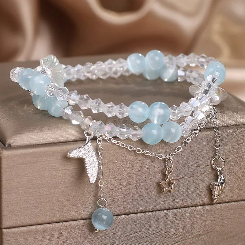 Light blue double circle aquamarine bracelet for women with two interlocking rings.