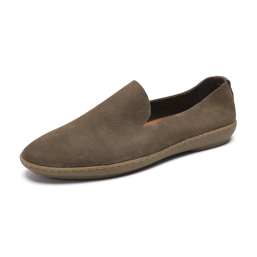 Handmade grey low top men's shoes with a wedge heel and rubber sole.