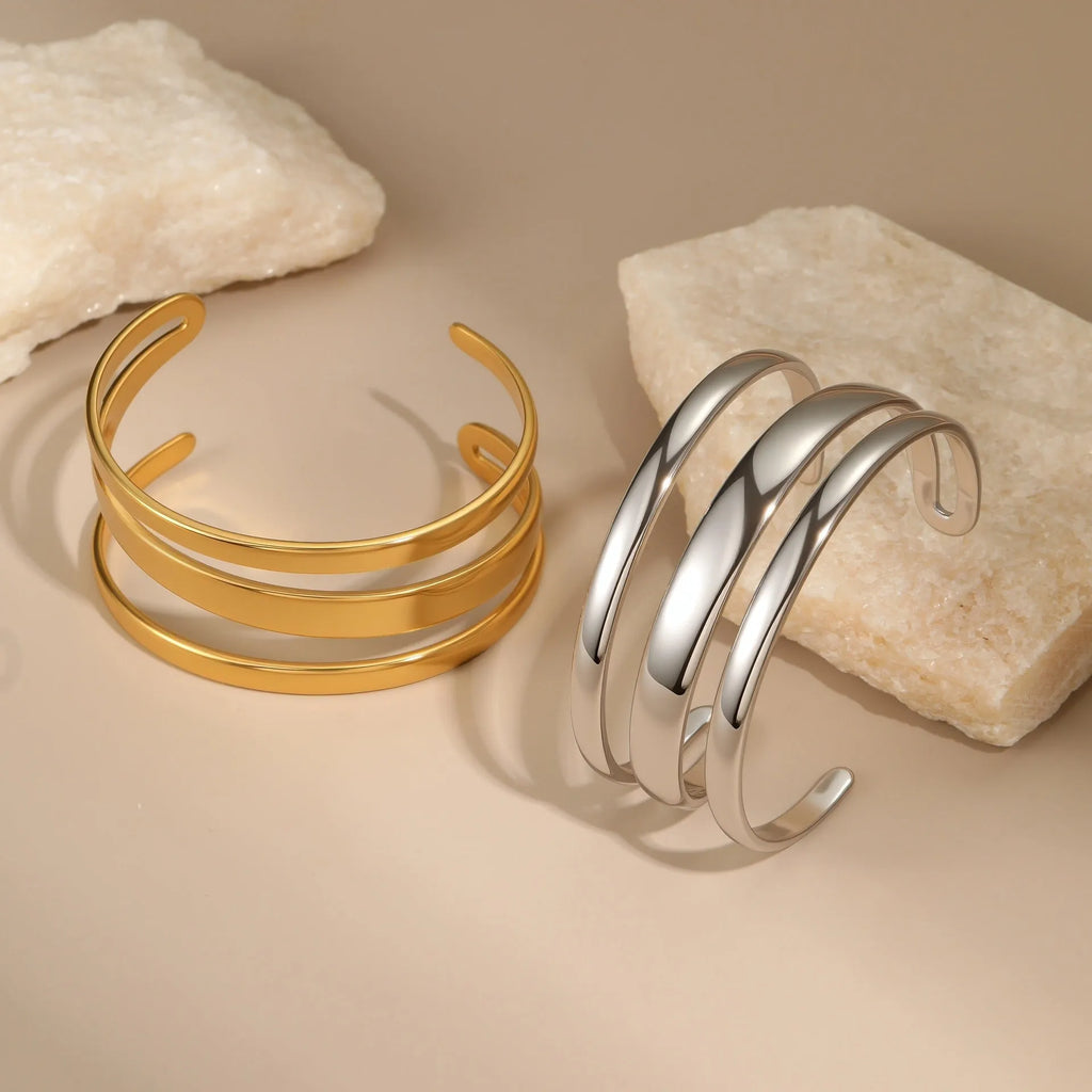 Geometric line stainless steel bracelet for women, showing gold electroplated and natural steel finish options