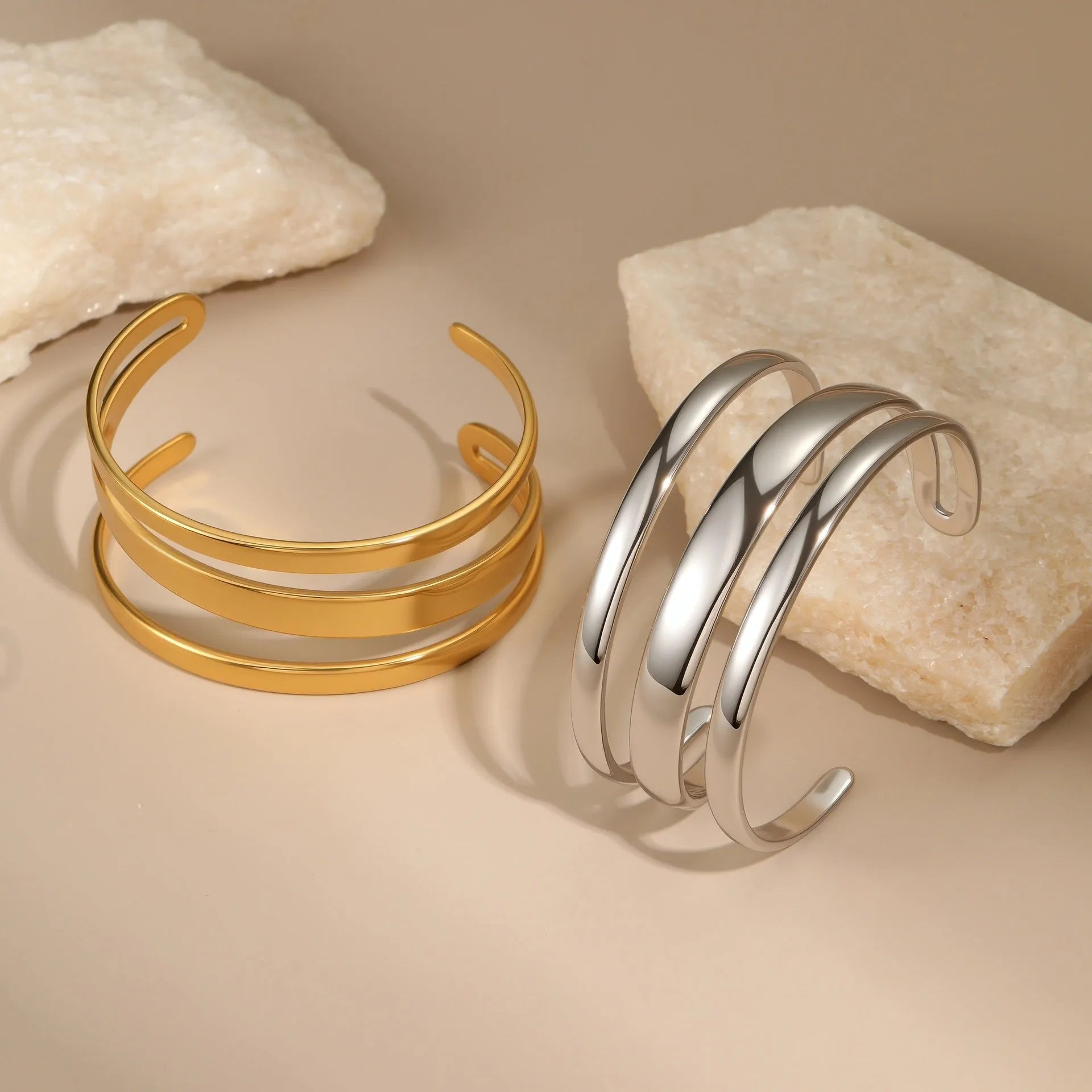 Geometric line stainless steel bracelet for women, showing gold electroplated and natural steel finish options