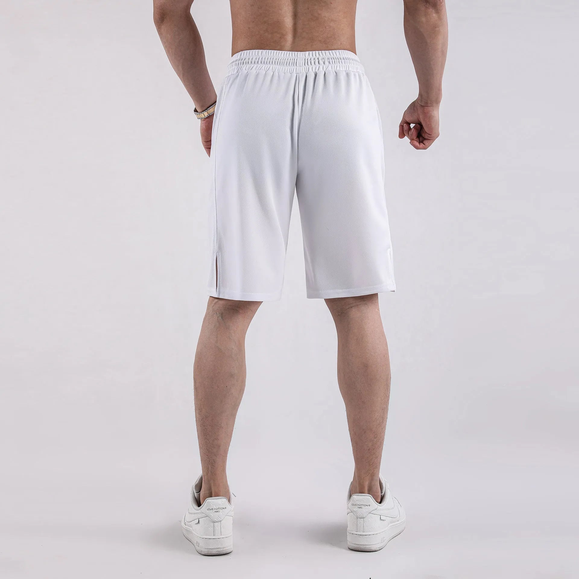 Men's black quick-drying mesh shorts with elastic waistband and loose casual fit