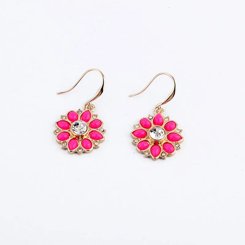 Pair of alloy flower-shaped earrings with artificial gemstone inlay, available in blue or red for women