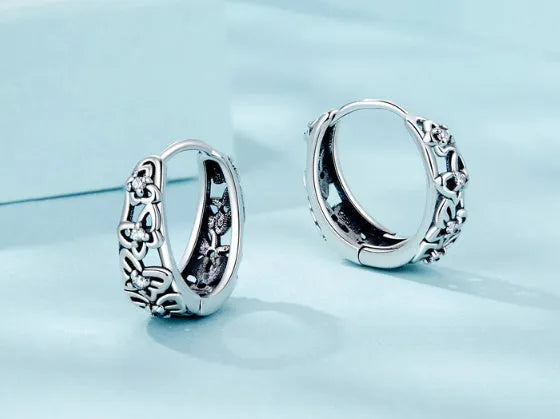 Sterling silver retro hollow butterfly earrings with zircon accents measuring 14mm by 5mm