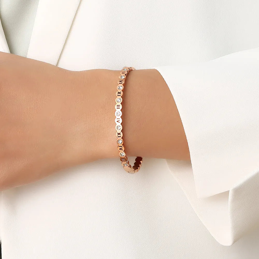 Korean style titanium steel bracelet with numerical elements in gold, rose gold, or steel colour finish