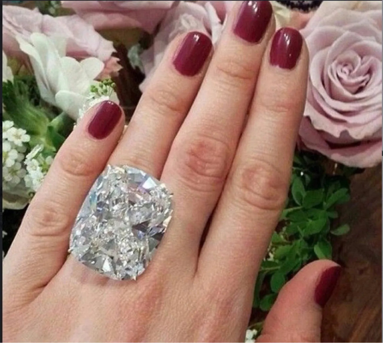 Women's white gold colour alloy ring with a simple inlaid square diamond on a geometric band.
