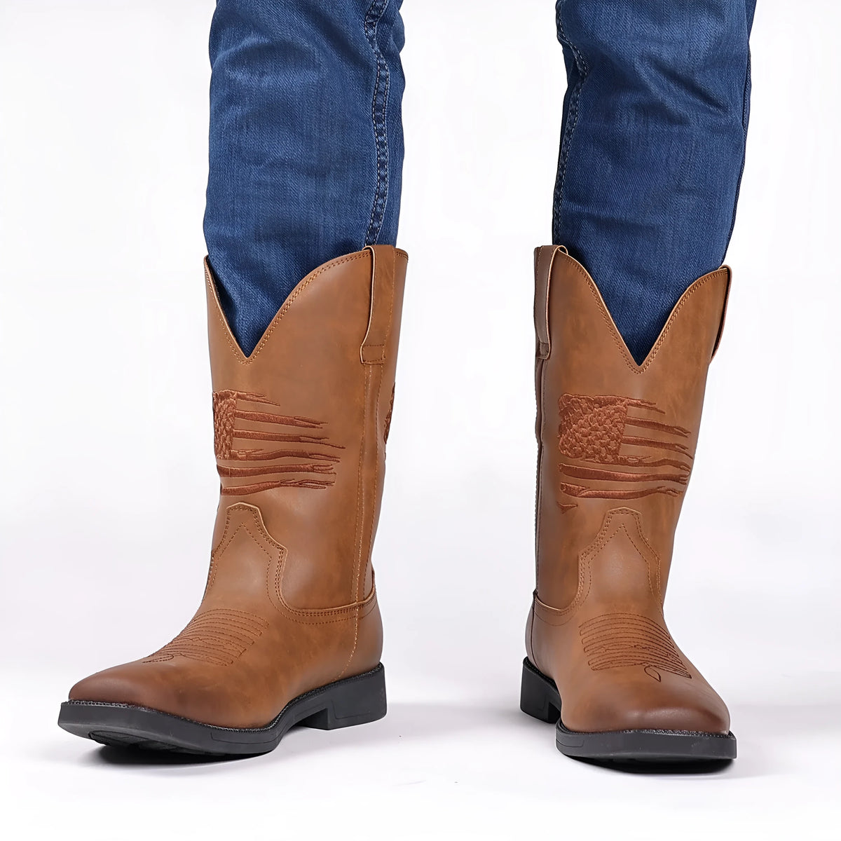 Brown retro cowboy boot for men with embroidery on the artificial leather upper and a square toe.