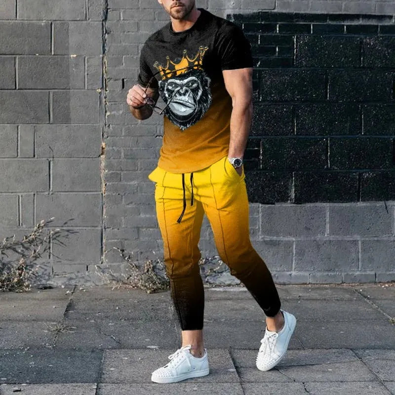 Man wearing a short sleeve printed pullover and matching trousers from a men's two-piece sports set.