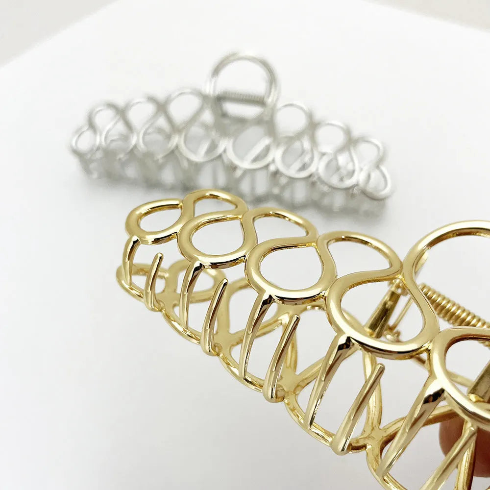 Large minimalist alloy hair clip with tassel detailing in gold or silver finish for women's updos