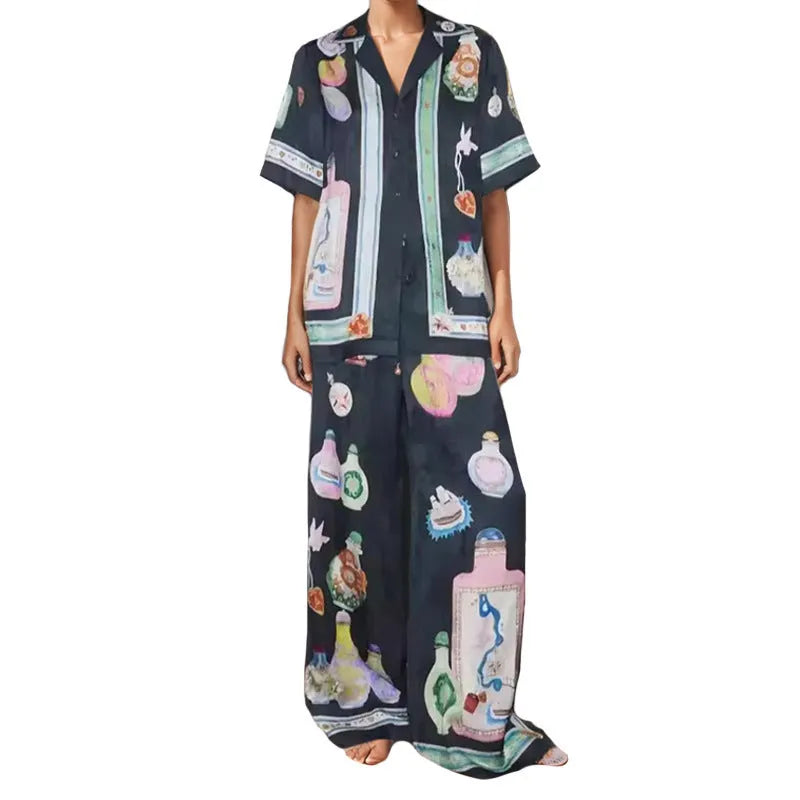Women's black casual two-piece set with cartoon animation print, cardigan sleeve top, and matching trousers
