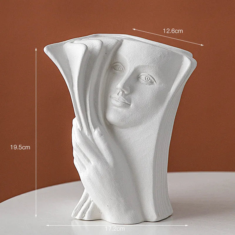 Ceramic book stand with glazed surface in one of four artistic designs: lover, dancer, beauty and beast, or brushed face