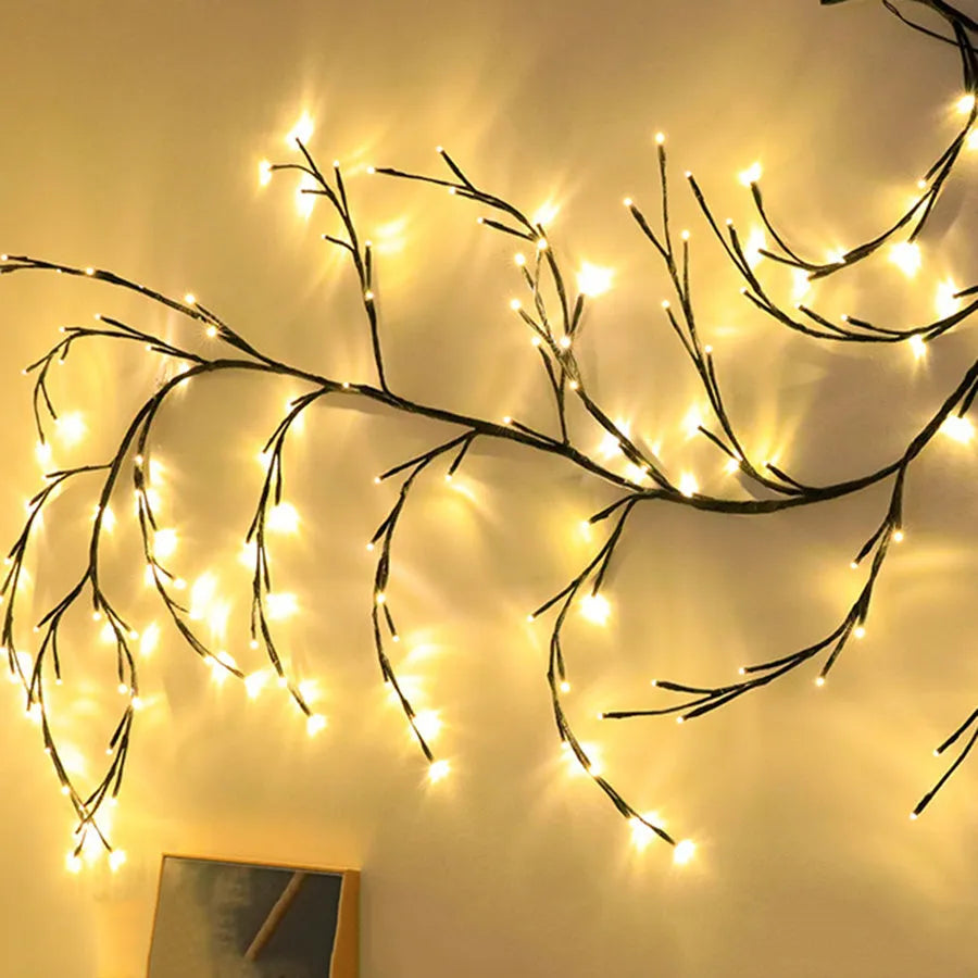 Flexible DIY LED willow vine garland light with warm white LEDs bent into a decorative shape.