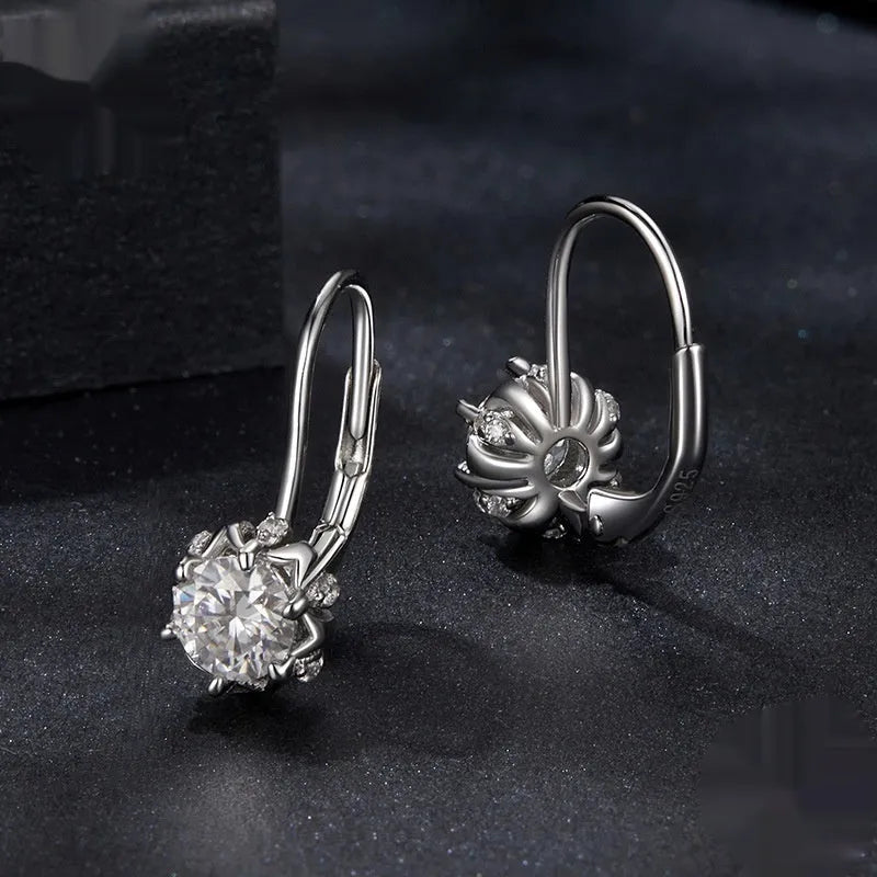 Sterling silver flower bud clip earrings with white gold plating and 0.5 carat moissanite stone