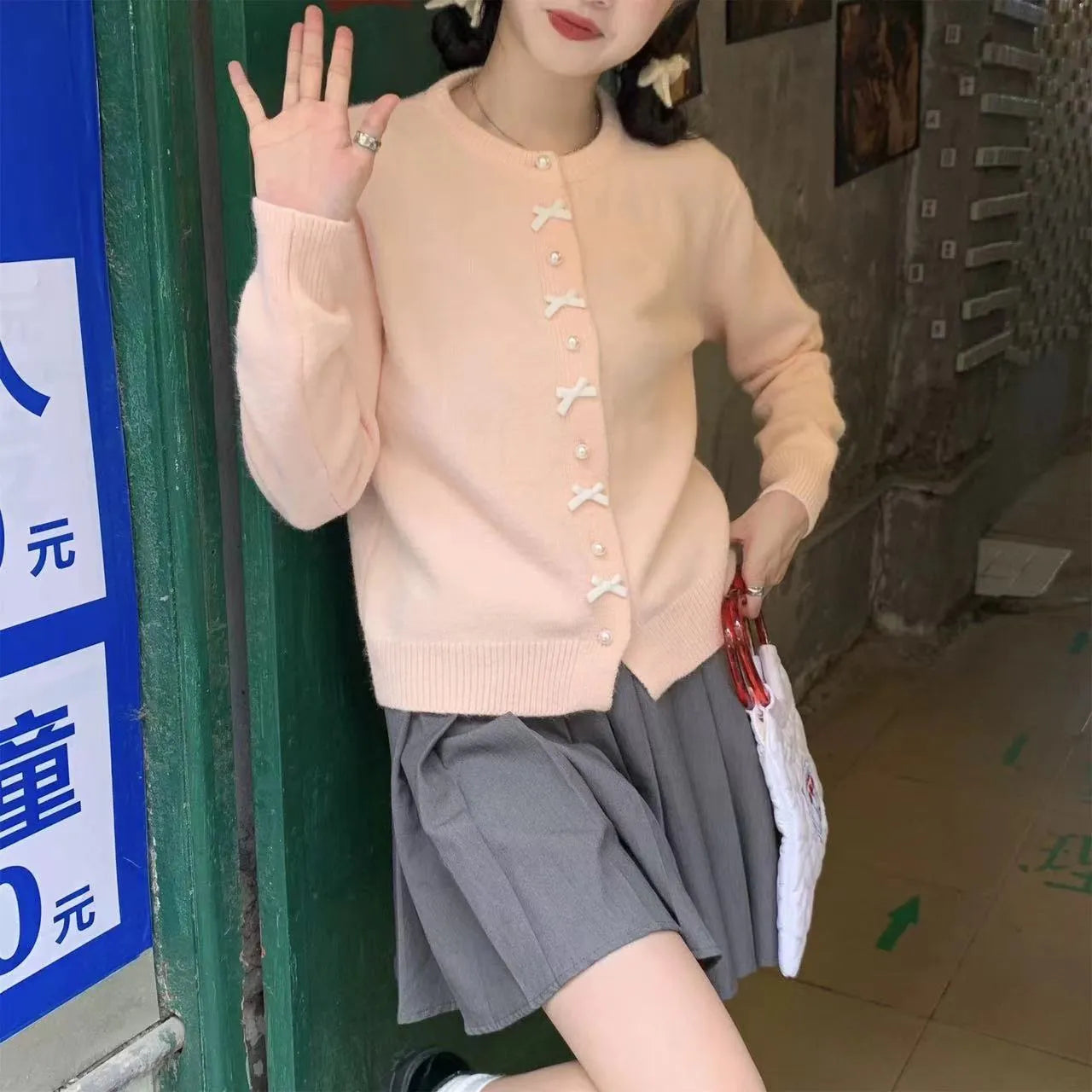 Women's cashmere acrylic cardigan with bow decoration and pearl buttons in various colours