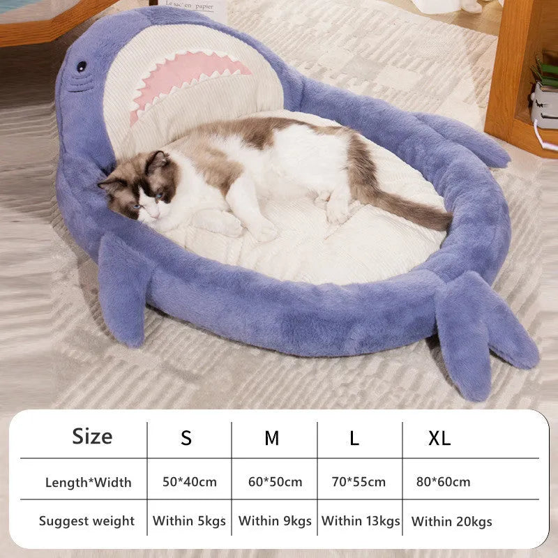Blue shark pattern pet bed for dogs and cats on a wooden floor, showing plush velvet material.