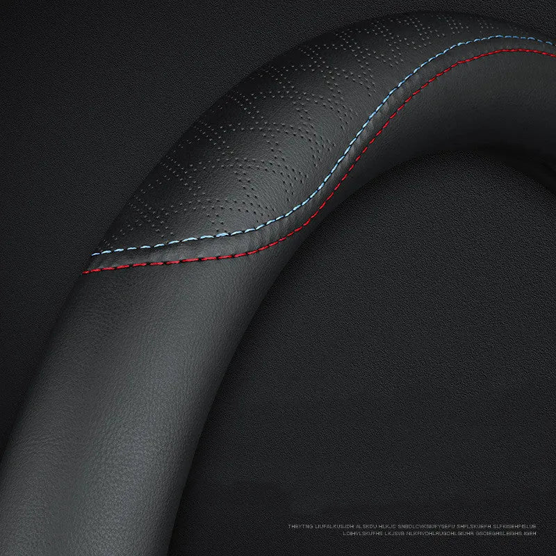 Black universal car steering wheel cover with stitch detailing, shown fitted on a 38cm wheel.