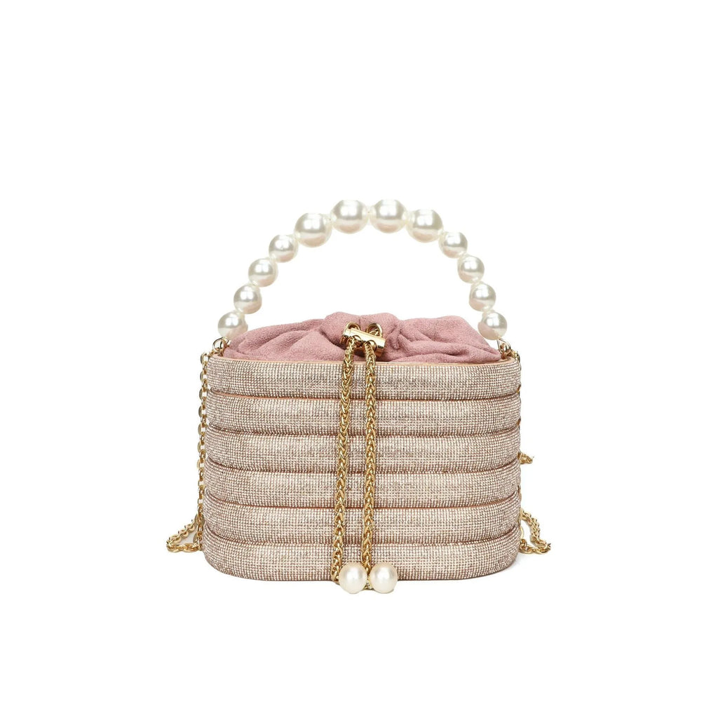 Round women's crossbody bag with beaded pearl details and single shoulder strap in retro styling