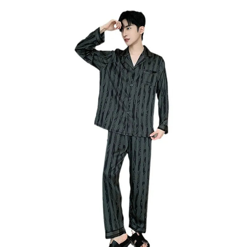 Black striped men's ice silk two-piece pajama set with V-neck top and long trousers.