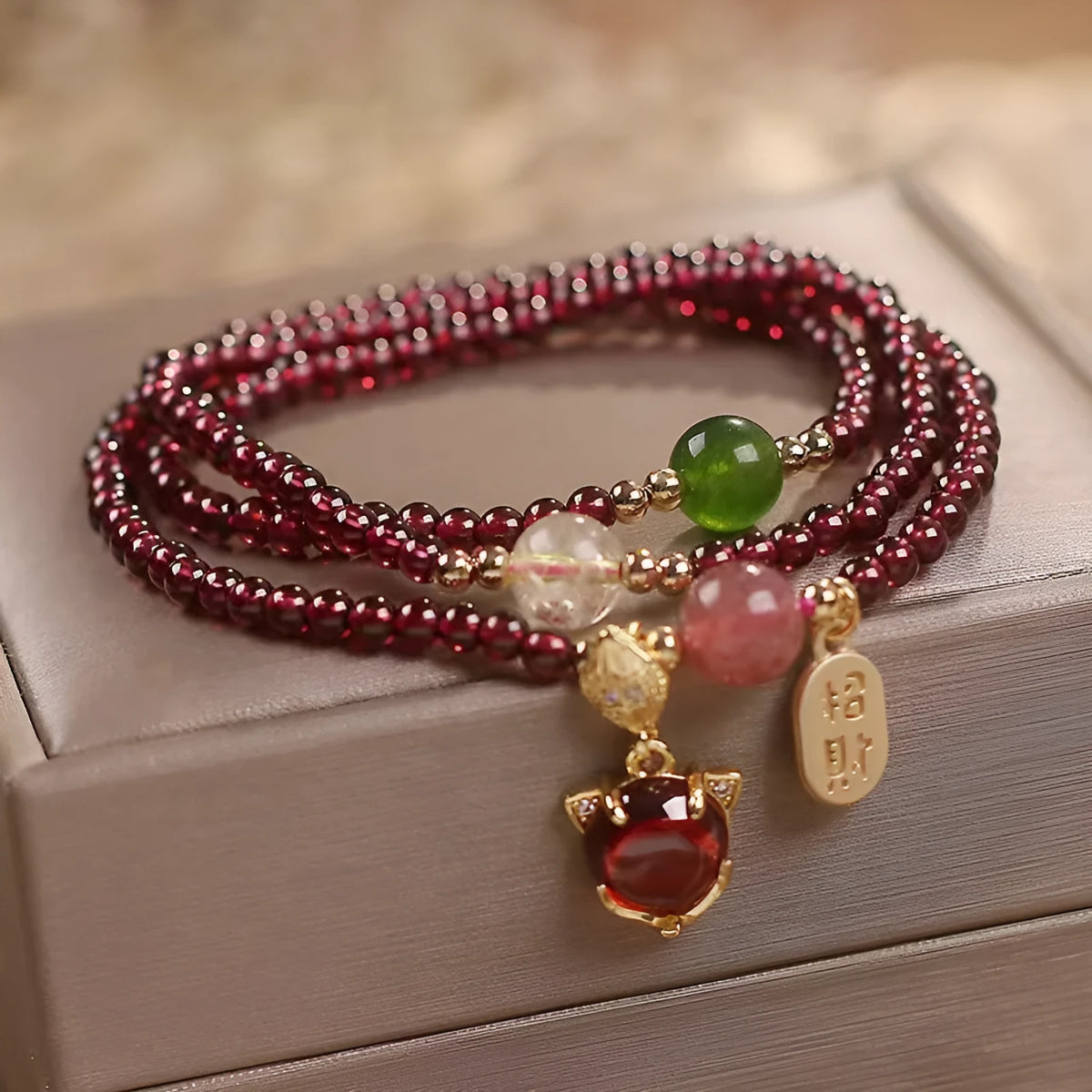 Purplish red garnet crystal bracelet with fox charm and adjustable rope