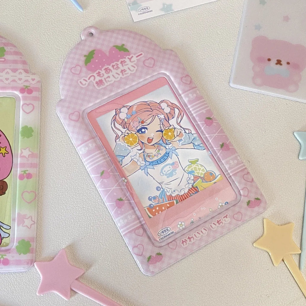 Transparent PVC card holder with cartoon strawberry or four-leaf clover design, measuring 7.6 by 13.6 cm.