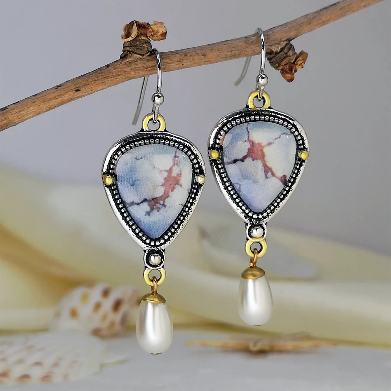 Retro blue geometric drop earrings with synthetic opal and pearl on metal.