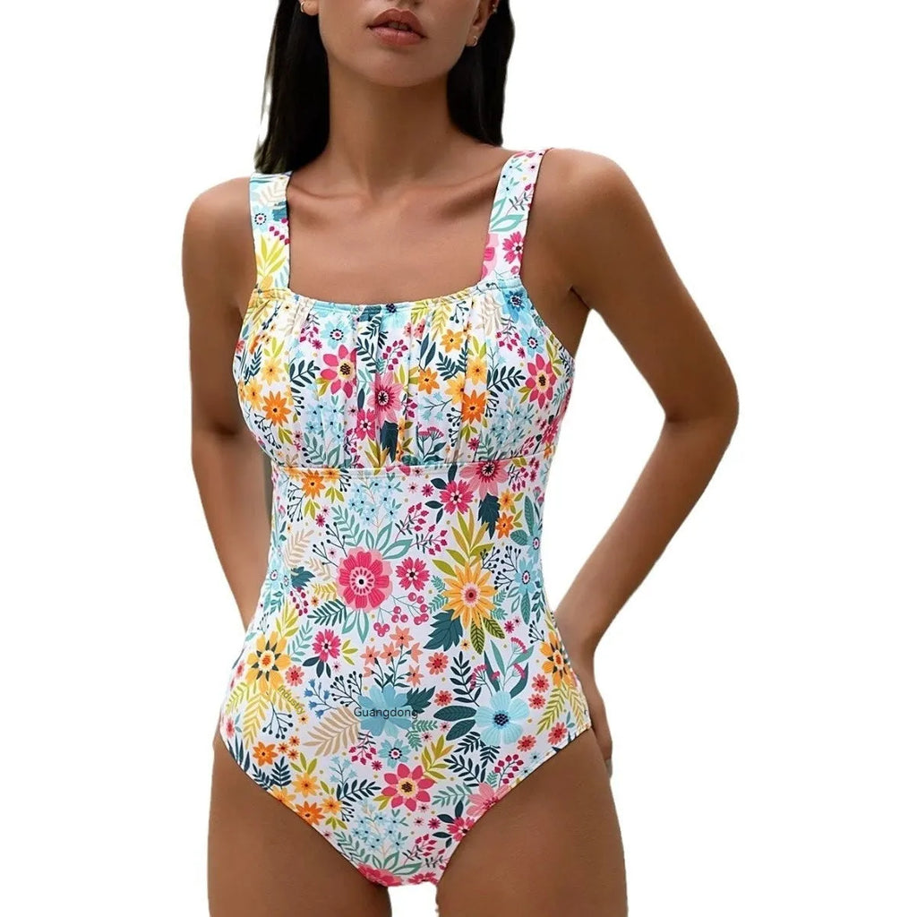 Women's floral print one-piece full-bed swimsuit on a hanger, showing front and back.