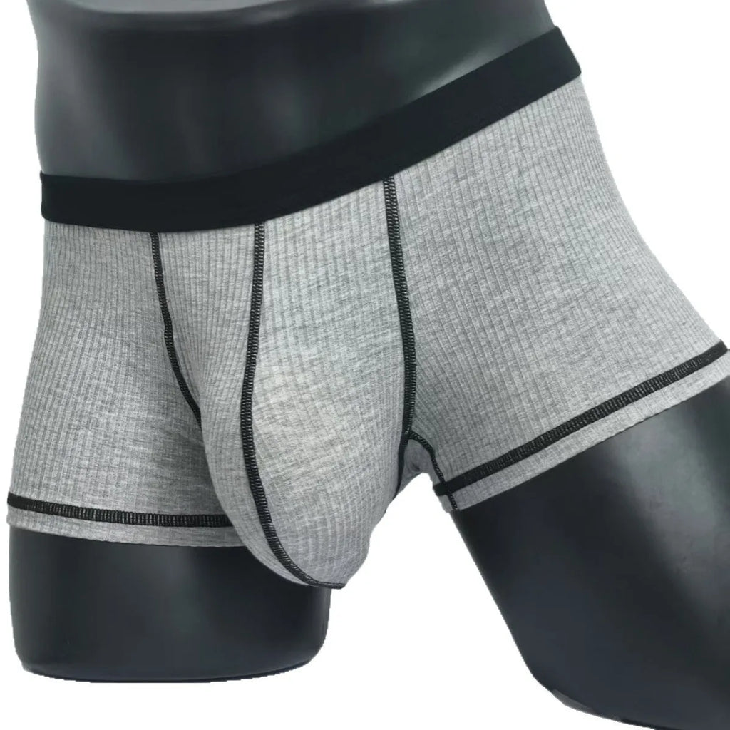 Men's solid colour boxer shorts in Army Green on a white background, showing the breathable fibre fabric.