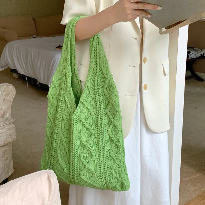 Retro hollow knitted women's tote bag in a solid colour with double shoulder straps.