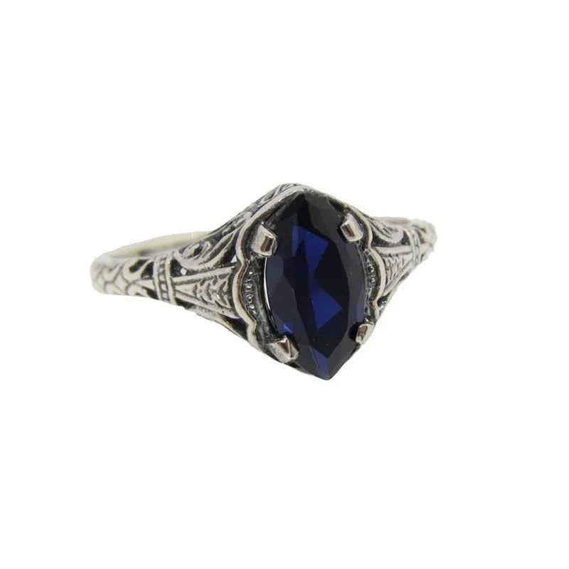 Silver women's ring with geometric hollow pattern in alloy metal showing side profile view