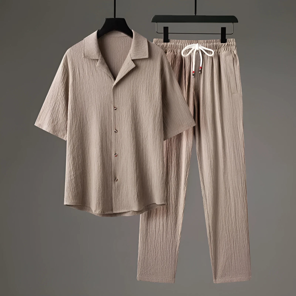 Men's Chinese style two-piece knitwear set showing short-sleeved top and trousers in polyester fabric