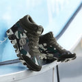Green camouflage pattern on women's canvas casual sneakers with a rubber sole.
