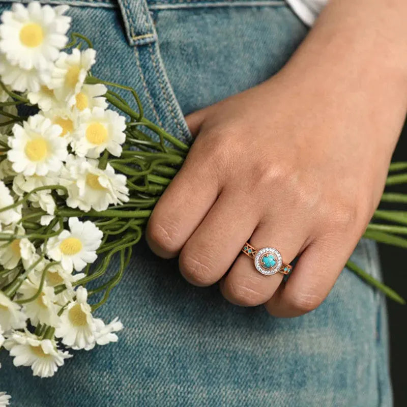 Women's geometric turquoise copper ring with rose gold plating and a micro inlaid zircon detail.