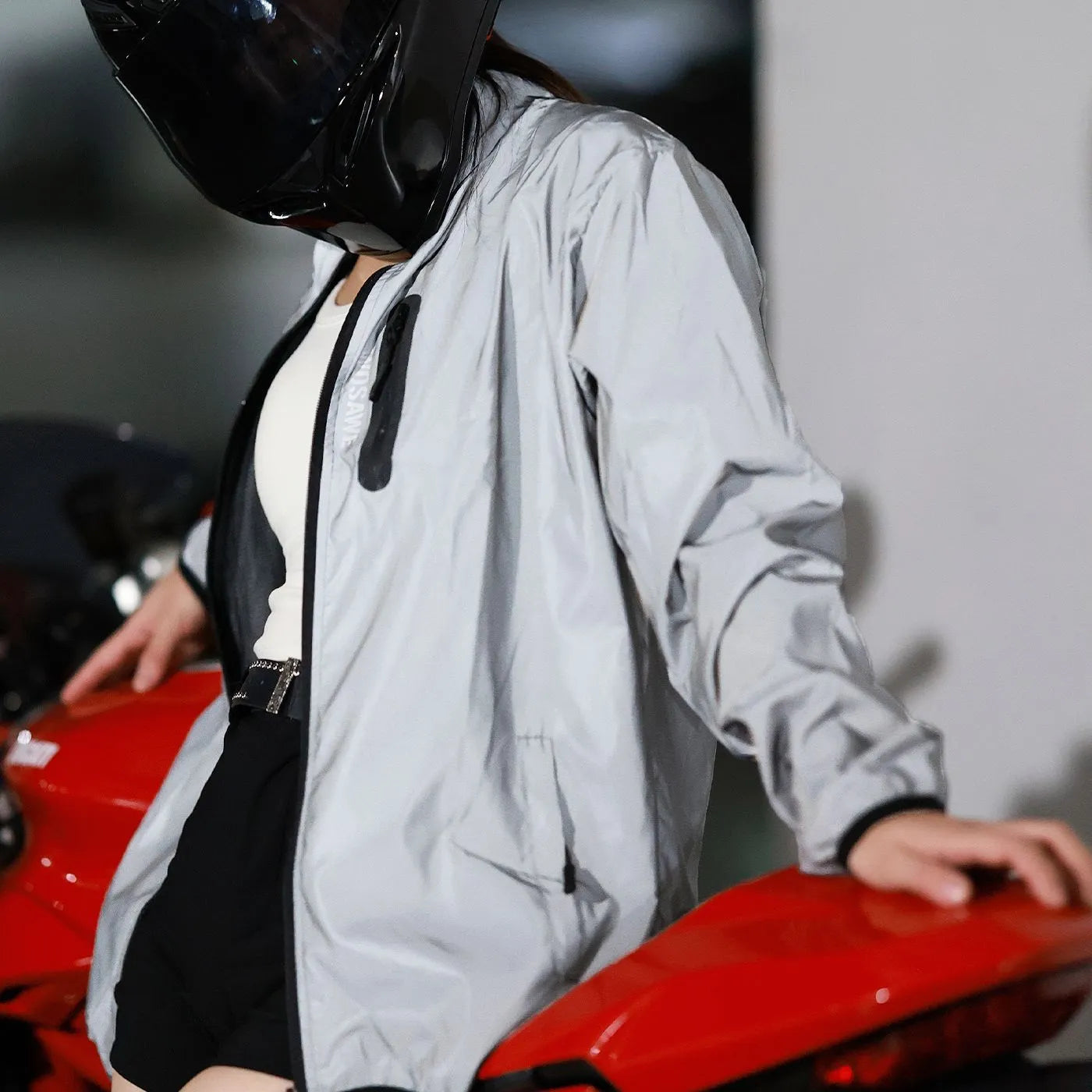 Silver waterproof polyester long sleeve top for men on a hanger.