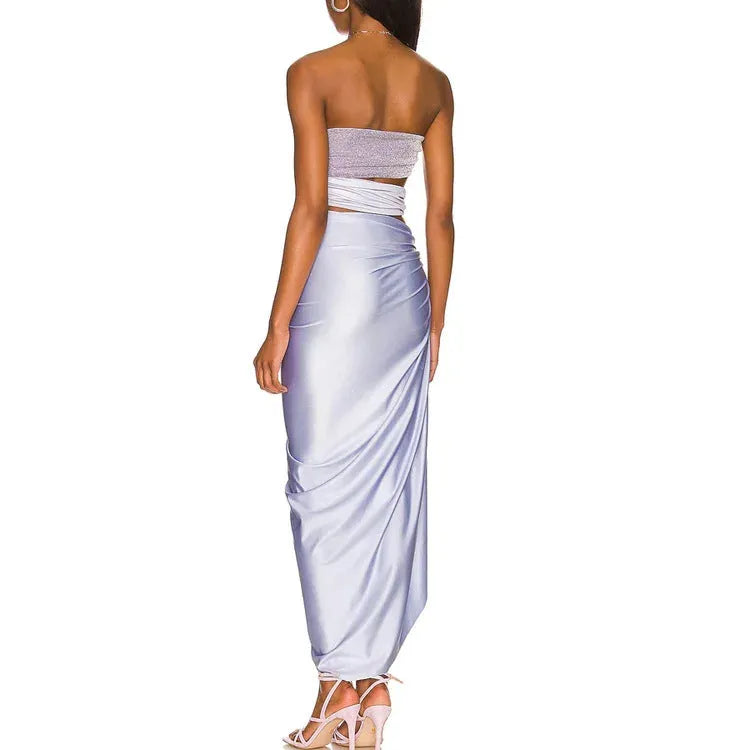 Purple one-piece swimsuit with matching wrap skirt on a mannequin, showing the tight fit and European/American styling.