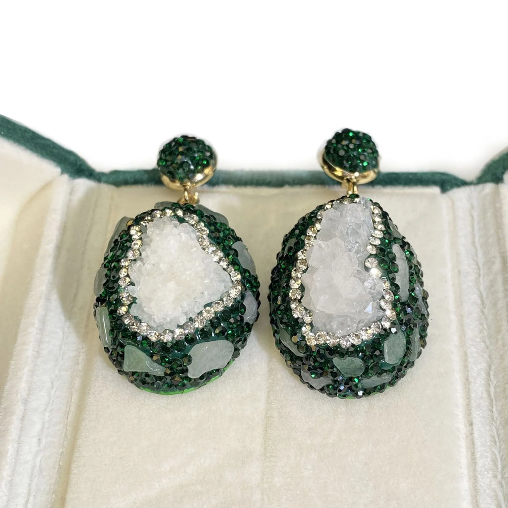 Crystal Bud Inlaid Emerald Earrings in dark green with a copper geometric base and crystal bud detail on a white background