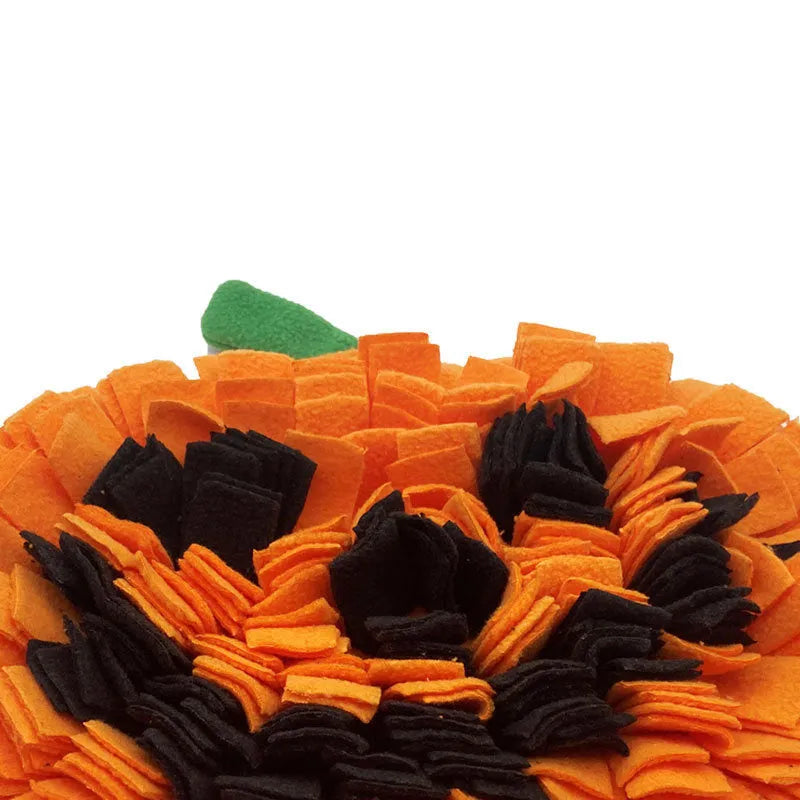 Orange pumpkin-shaped dog sniffing mat with textured fur surface for slow feeding