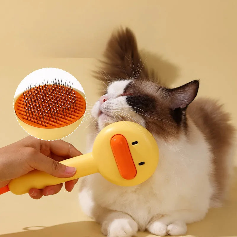 Yellow plastic pet grooming comb with open-section needle teeth for removing hair from cats and dogs.
