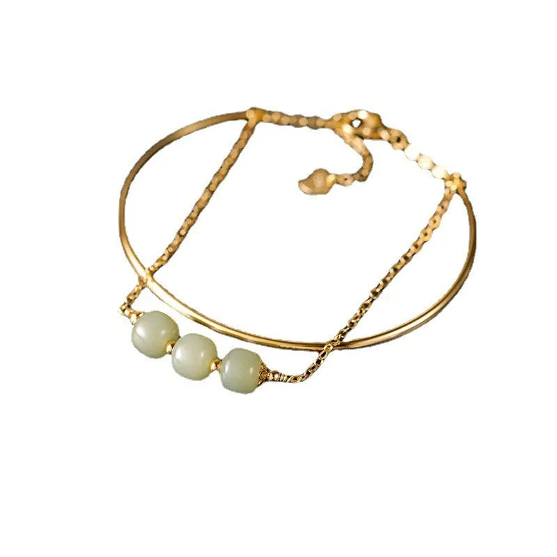 Women's Hetian jade bracelet with gold inlay design available in single, double or three bead versions