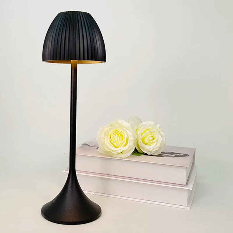 Modern dimming desk lamp in black or white with a thin round base and USB cable.