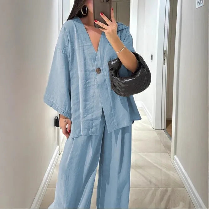 Women's solid colour two-piece set with long sleeve cardigan top and matching trousers, zip and button front, sizes S to XXL