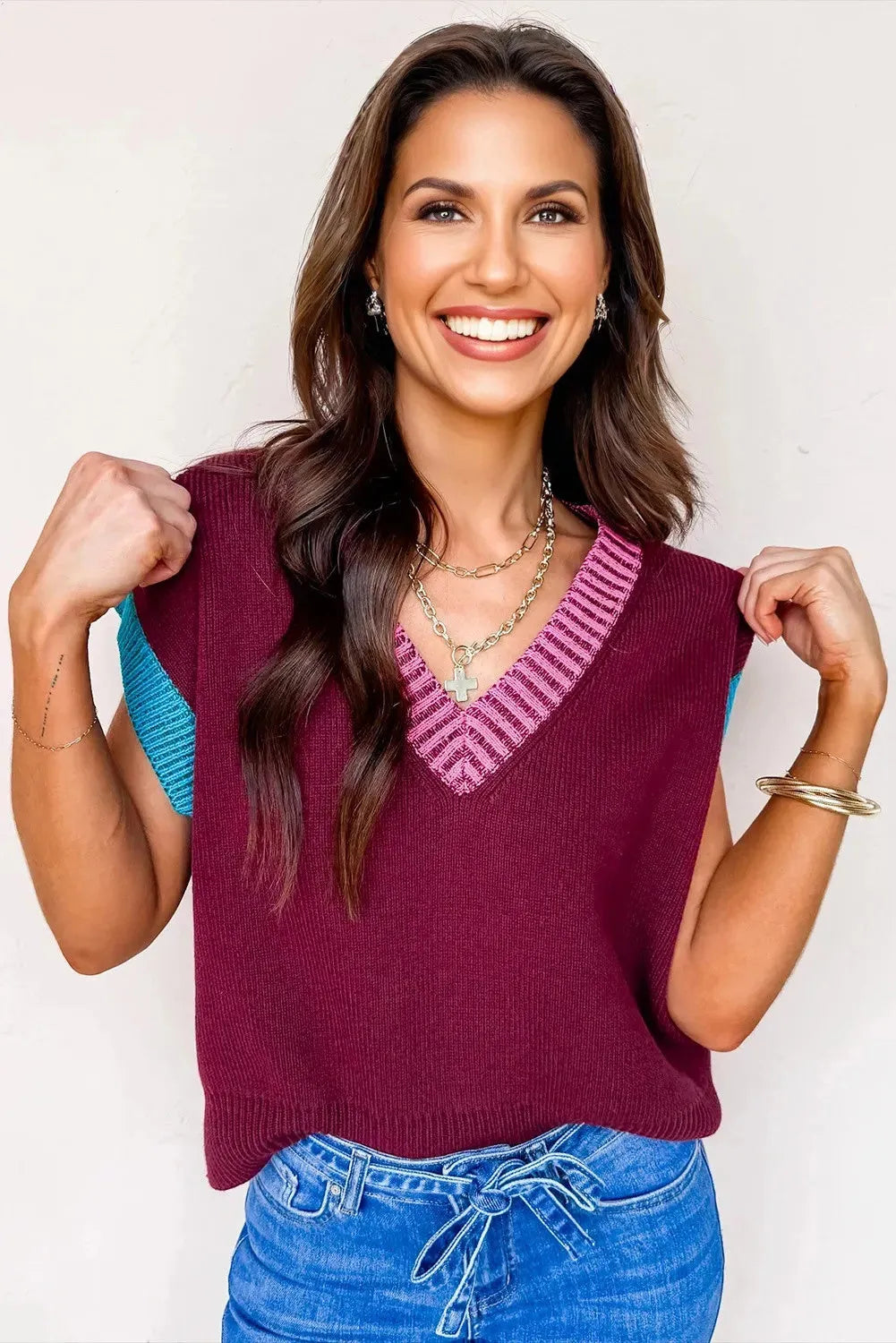 Burgundy loose knit V-neck sweater with contrast trim and cuffed short sleeves